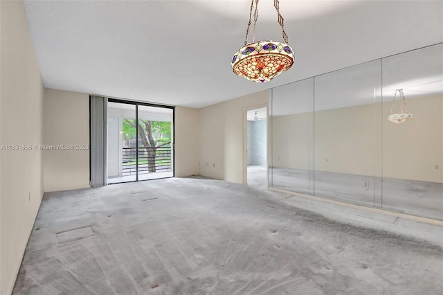 1001 Colony Point Cir Unit 220, Pembroke Pines, FL 33026 - carpeted spare room featuring a wall of windows