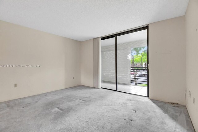 1001 Colony Point Cir Unit 220, Pembroke Pines, FL 33026 - carpeted spare room featuring floor to ceiling windows