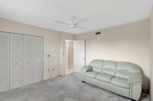 1001 Colony Point Cir Unit 220, Pembroke Pines, FL 33026 - living area featuring carpet flooring, ceiling fan, and a textured ceiling