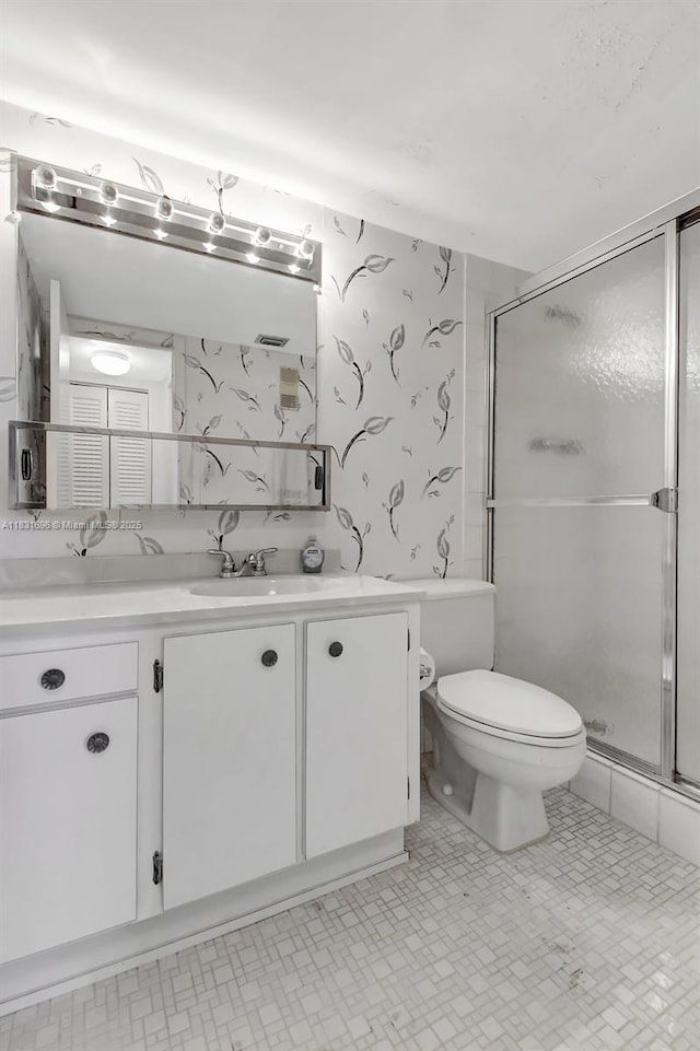 1001 Colony Point Cir Unit 220, Pembroke Pines, FL 33026 - bathroom featuring vanity, a shower stall, and wallpapered walls