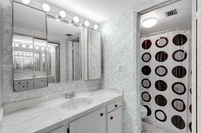 1001 Colony Point Cir Unit 220, Pembroke Pines, FL 33026 - bathroom featuring vanity, wallpapered walls, and a shower with shower curtain