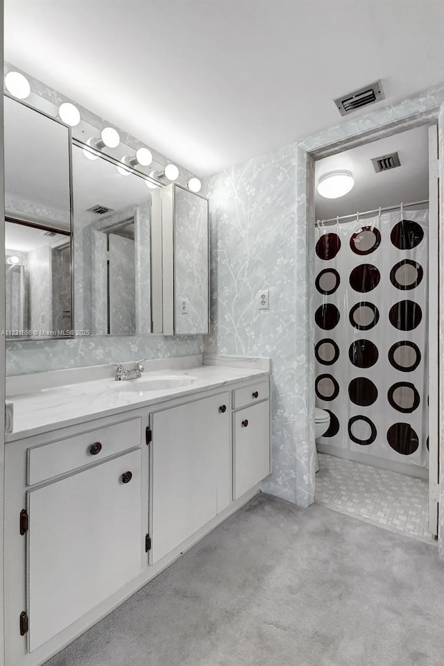 1001 Colony Point Cir Unit 220, Pembroke Pines, FL 33026 - bathroom featuring wallpapered walls, vanity, and a shower with shower curtain