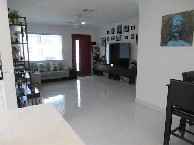 6910 SW 26th Ct, Miramar, FL 33023 - living room with a ceiling fan and crown molding