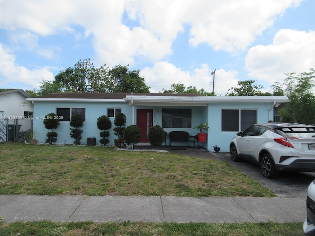 6910 SW 26th Ct, Miramar, FL 33023 - ranch-style house with a front lawn, stucco siding, and a porch