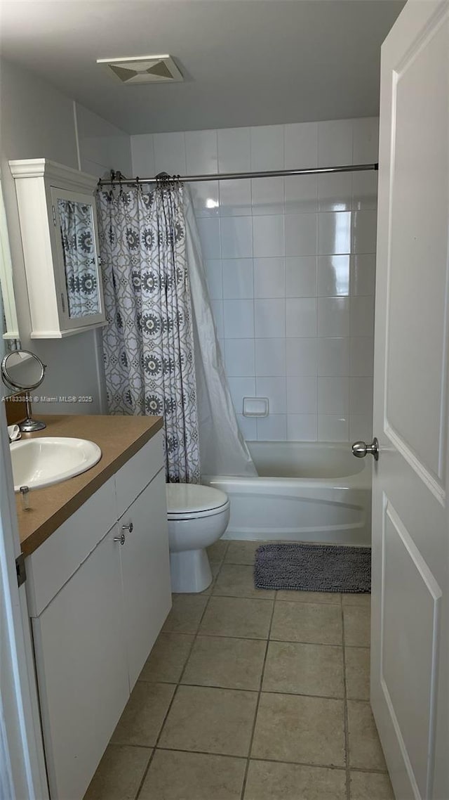 1250 S Miami Ave Unit 1209, Miami, FL 33130 - full bath featuring vanity, tile patterned floors, and shower / bath combo with shower curtain