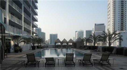 1250 S Miami Ave Unit 1209, Miami, FL 33130 - community pool with a city view and a patio area