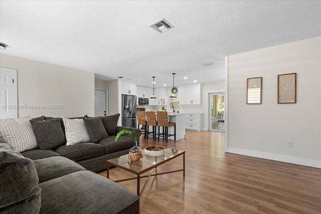 9360 SW 185th St, Cutler Bay, FL 33157 - living room with light wood-type flooring and baseboards