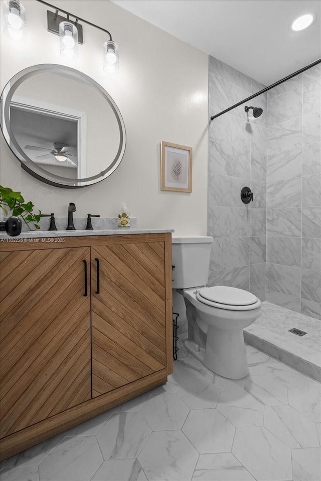 9360 SW 185th St, Cutler Bay, FL 33157 - full bathroom with marble look tiles, a ceiling fan, vanity, and tiled shower