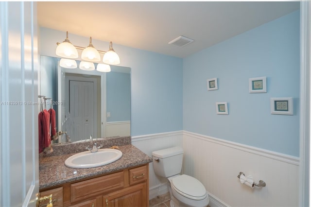 101 Gulfview Dr Unit 202, Key Colony, FL 33036 - half bathroom featuring wainscoting and vanity