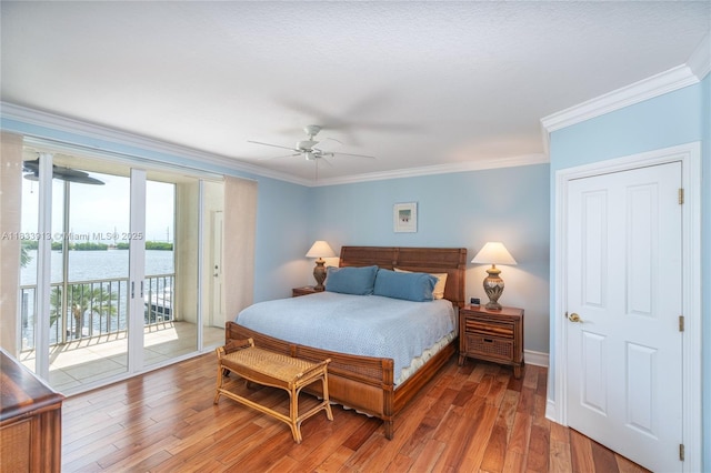 101 Gulfview Dr Unit 202, Key Colony, FL 33036 - bedroom with access to outside, crown molding, wood finished floors, a water view, and ceiling fan
