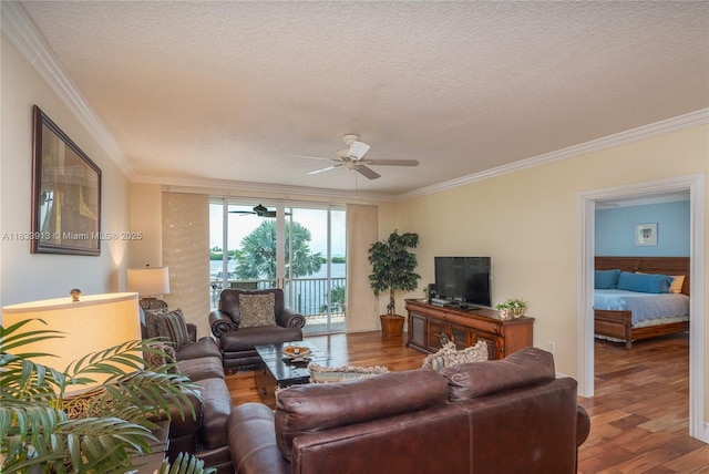 101 Gulfview Dr Unit 202, Key Colony, FL 33036 - living area with a ceiling fan, ornamental molding, wood finished floors, and a textured ceiling