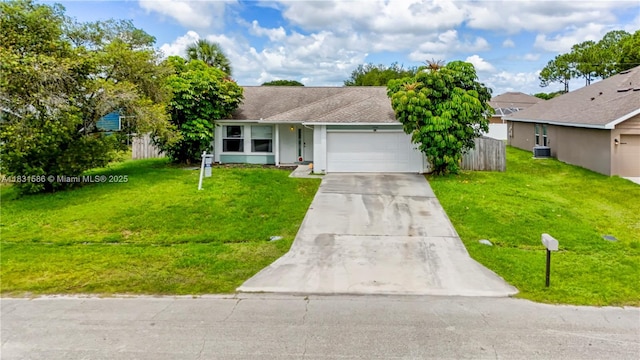 1226 SW Curry St, Port St Lucie, FL 34983 - view of front of house with driveway, an attached garage, a front yard, and stucco siding