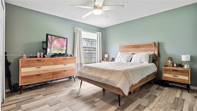 1226 SW Curry St, Port St Lucie, FL 34983 - bedroom with a textured ceiling, wood finished floors, and a ceiling fan