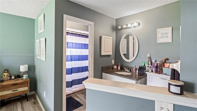 1226 SW Curry St, Port St Lucie, FL 34983 - full bathroom featuring a textured ceiling, wood finished floors, vanity, and a shower with shower curtain