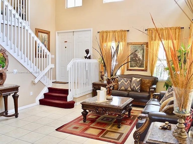 15601 SW 31st Ln, Miami, FL 33185 - tiled living room featuring stairway and a towering ceiling