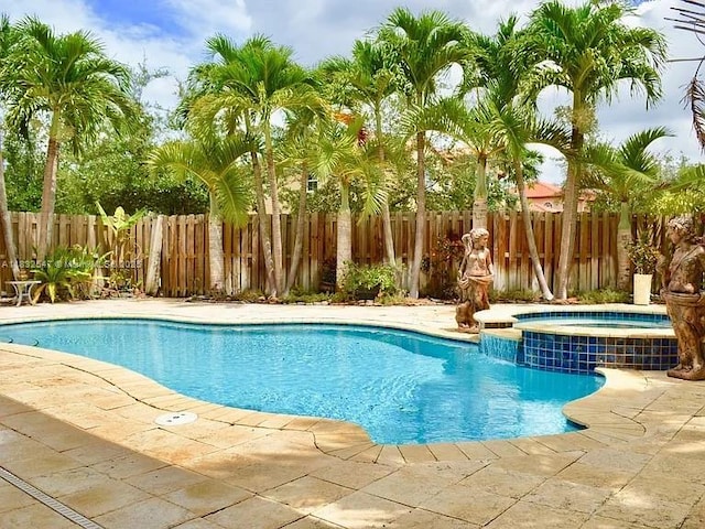 15601 SW 31st Ln, Miami, FL 33185 - view of pool featuring a pool with connected hot tub and a patio