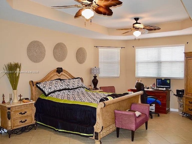 15601 SW 31st Ln, Miami, FL 33185 - bedroom featuring a tray ceiling, light tile patterned flooring, and ceiling fan