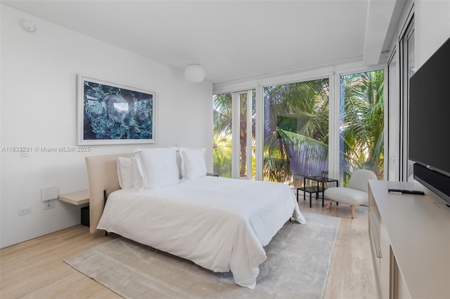 9001 Collins Ave Unit S-305, Surfside, FL 33154 - bedroom featuring light wood-style floors