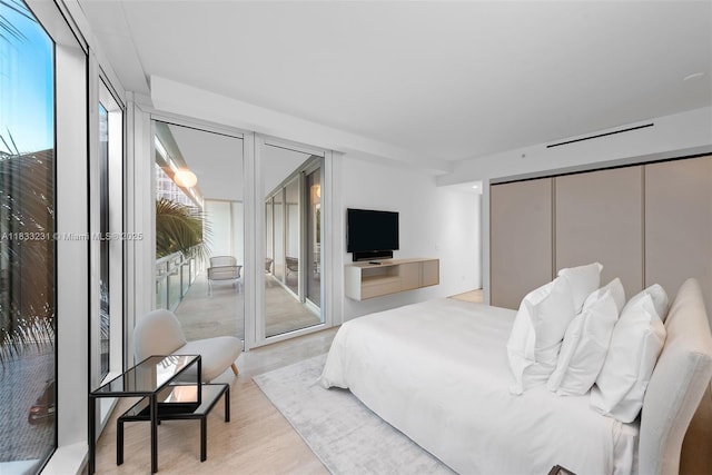 9001 Collins Ave Unit S-305, Surfside, FL 33154 - bedroom featuring light wood finished floors, access to exterior, and a closet