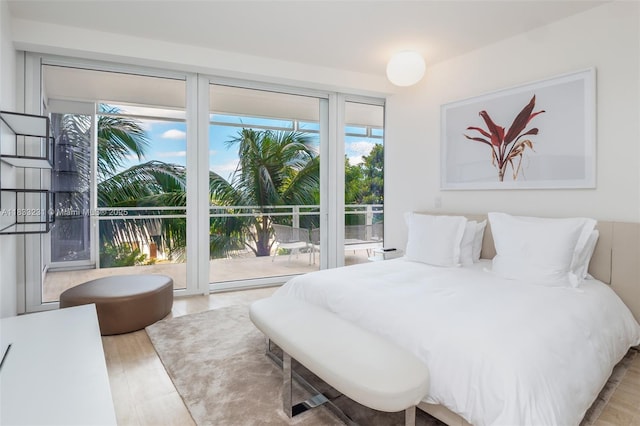 9001 Collins Ave Unit S-305, Surfside, FL 33154 - bedroom featuring access to outside and wood finished floors