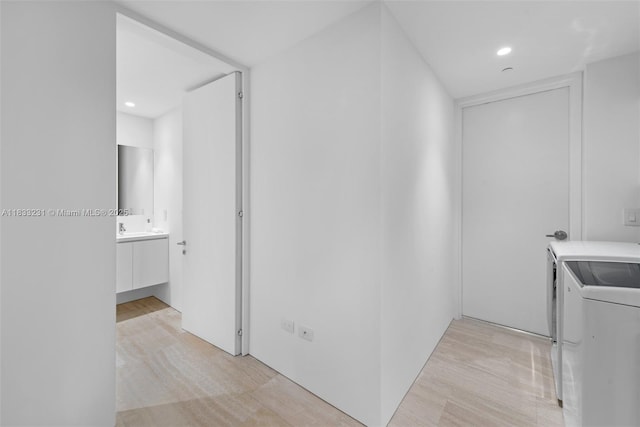 9001 Collins Ave Unit S-305, Surfside, FL 33154 - laundry room featuring washer and clothes dryer, recessed lighting, and light wood finished floors
