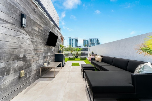 455 NE 39th St Unit 105, Miami, FL 33137 - view of patio featuring an outdoor living space