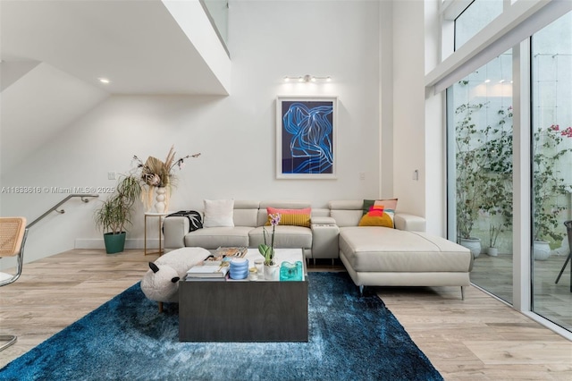 455 NE 39th St Unit 105, Miami, FL 33137 - living area with wood finished floors, recessed lighting, and lofted ceiling