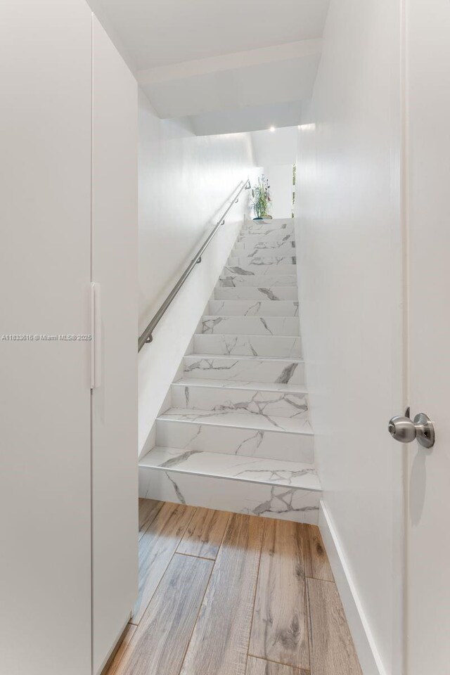 455 NE 39th St Unit 105, Miami, FL 33137 - staircase featuring wood finished floors