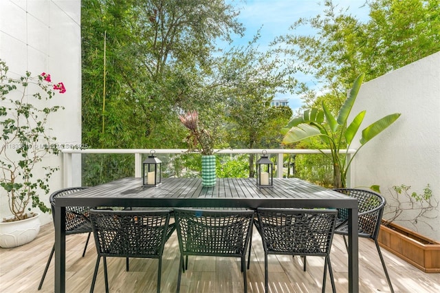 455 NE 39th St Unit 105, Miami, FL 33137 - wooden terrace with outdoor dining area