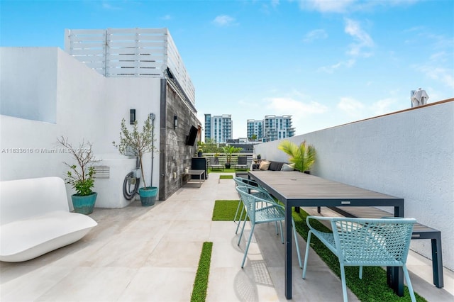 455 NE 39th St Unit 105, Miami, FL 33137 - view of patio / terrace with outdoor dining space and a view of city