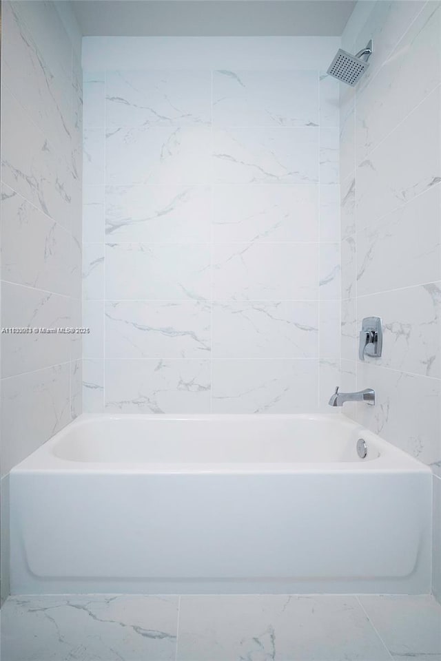 19380 NE 26th Ave Unit 304, Miami, FL 33180 - bathroom featuring marble finish floors and  shower combination