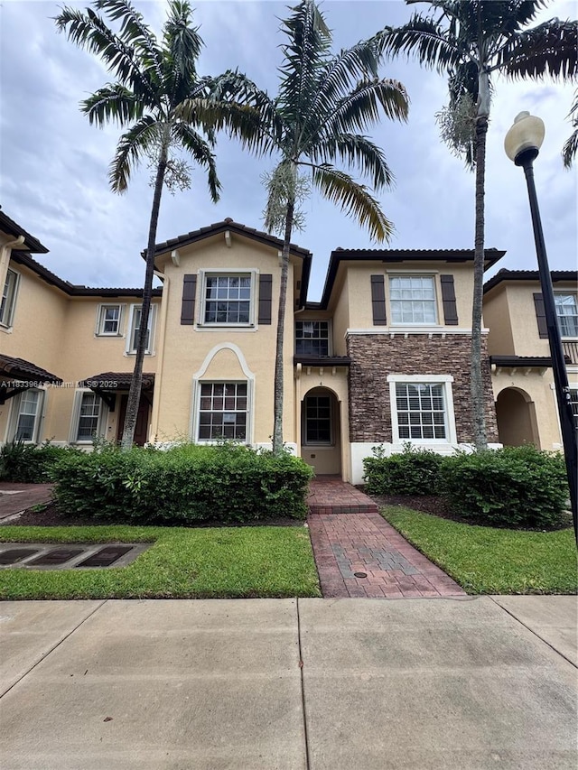9239 SW 227th St, Cutler Bay, FL 33190 - view of front of home with stucco siding and stone siding