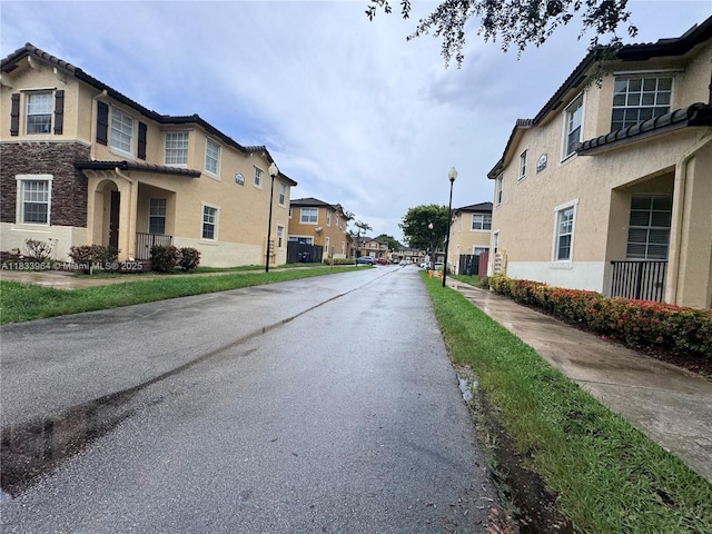 9239 SW 227th St, Cutler Bay, FL 33190 - view of asphalt road with a residential view and street lights