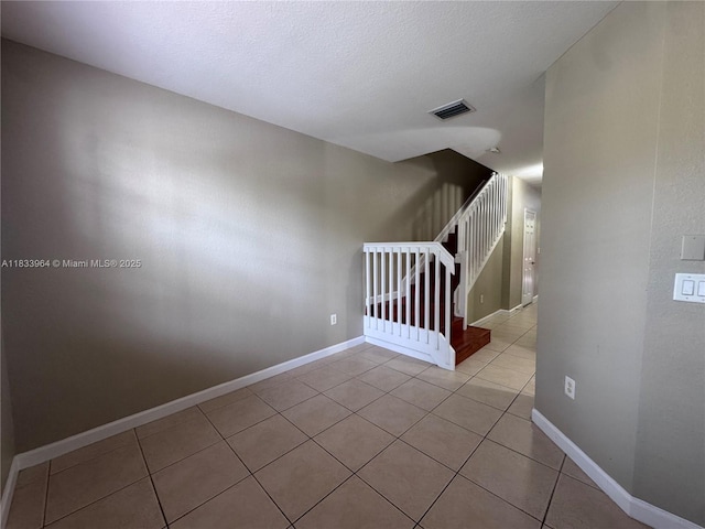 9239 SW 227th St, Cutler Bay, FL 33190 - empty room featuring light tile patterned flooring and stairway