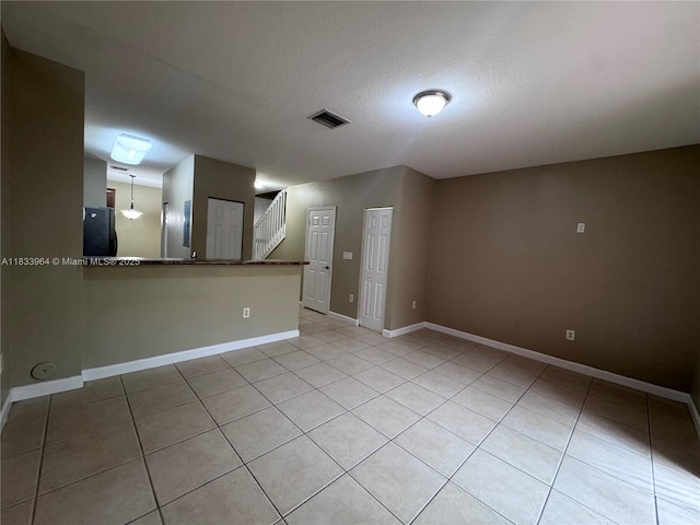 9239 SW 227th St, Cutler Bay, FL 33190 - unfurnished room featuring light tile patterned floors and stairway