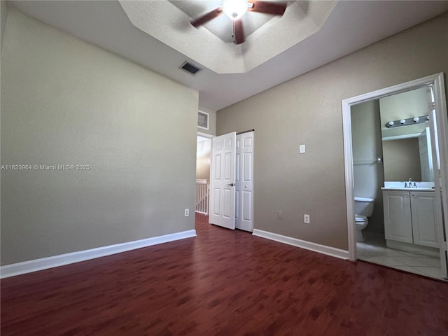 9239 SW 227th St, Cutler Bay, FL 33190 - unfurnished bedroom featuring wood finished floors, ensuite bathroom, and a ceiling fan