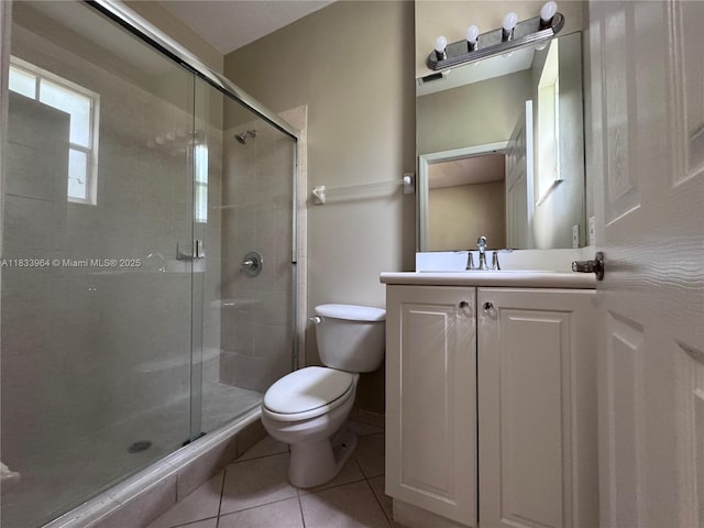 9239 SW 227th St, Cutler Bay, FL 33190 - bathroom featuring tile patterned floors, a shower stall, and vanity