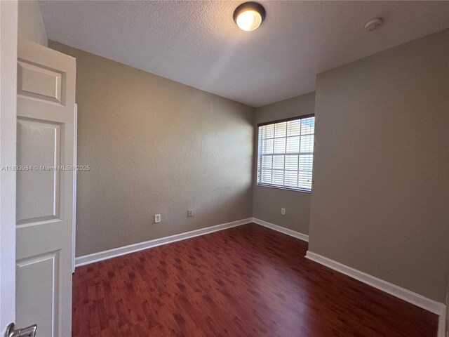 9239 SW 227th St, Cutler Bay, FL 33190 - empty room with wood finished floors and a smoke detector