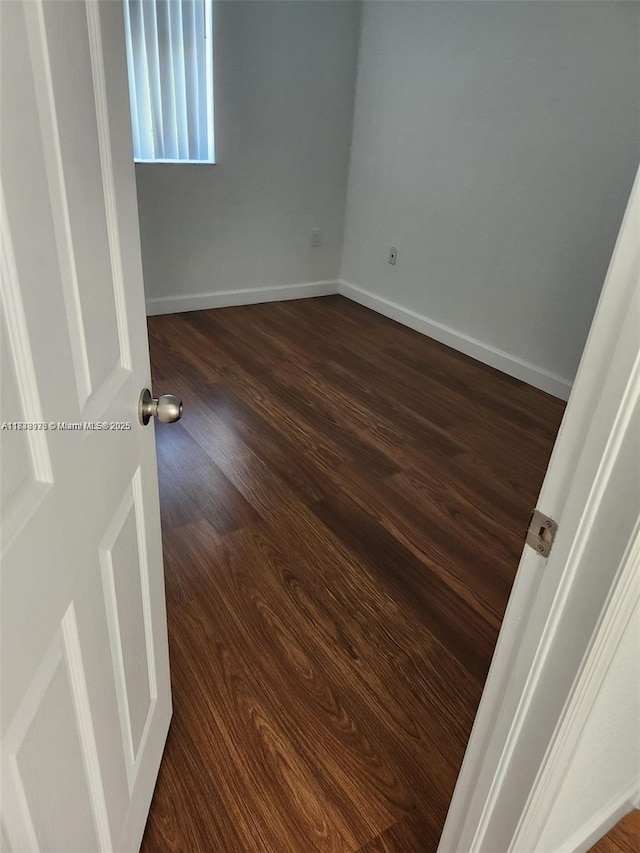8465 NW 108th Path, Doral, FL 33178 - empty room with dark wood-type flooring and baseboards