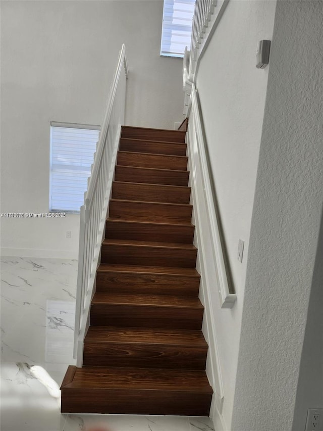 8465 NW 108th Path, Doral, FL 33178 - staircase with marble look tile flooring and baseboards