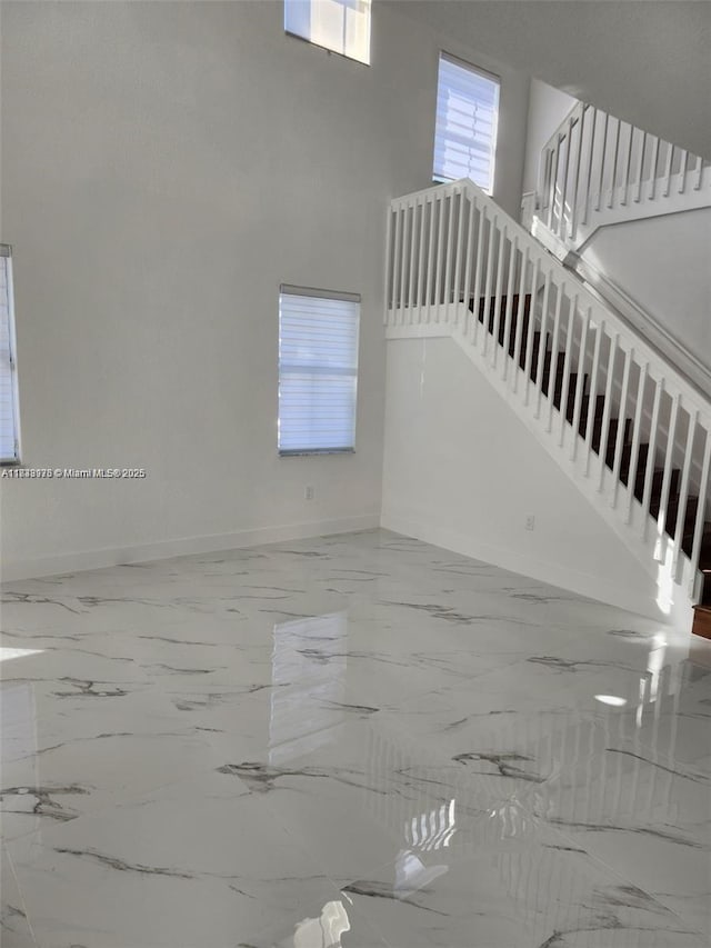 8465 NW 108th Path, Doral, FL 33178 - living area featuring plenty of natural light, marble finish floors, and a high ceiling