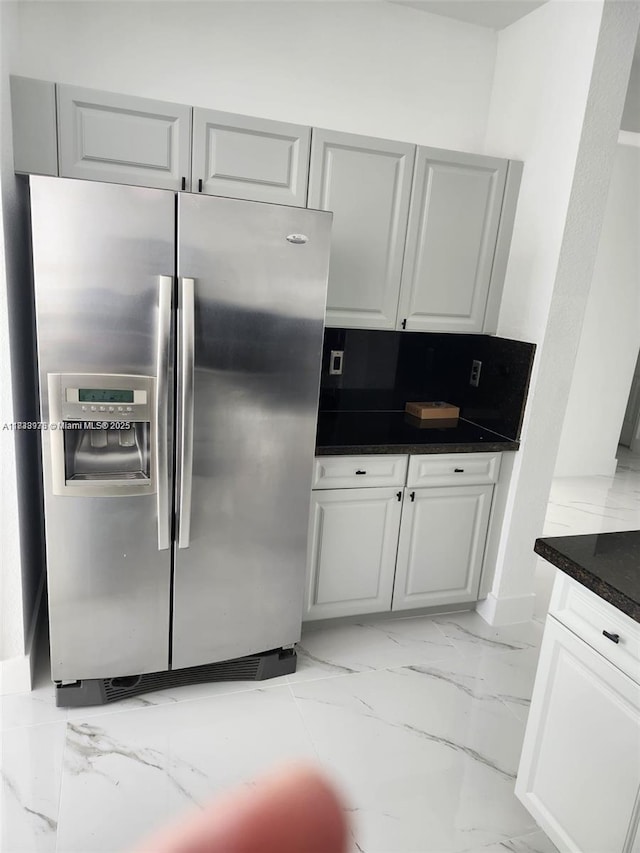 8465 NW 108th Path, Doral, FL 33178 - kitchen featuring stainless steel refrigerator with ice dispenser, dark countertops, light marble finish floors, and backsplash