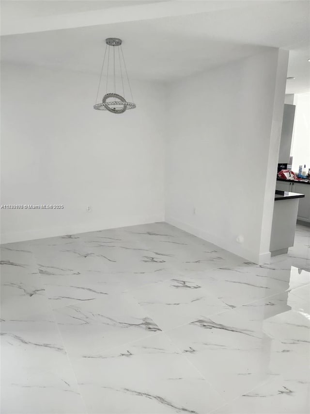 8465 NW 108th Path, Doral, FL 33178 - unfurnished room with baseboards