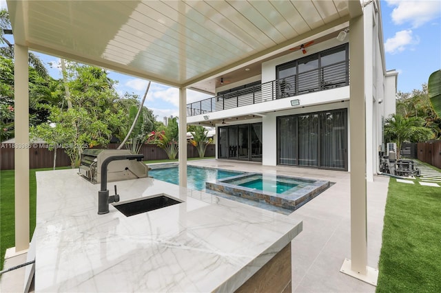 436 NE 10th Ave, Fort Lauderdale, FL 33301 - view of pool with a patio, a fenced backyard, and a pool with connected hot tub