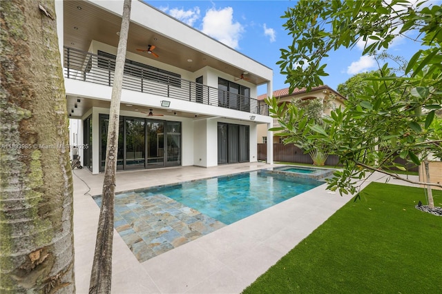 436 NE 10th Ave, Fort Lauderdale, FL 33301 - back of property with a balcony, a ceiling fan, stucco siding, and a patio