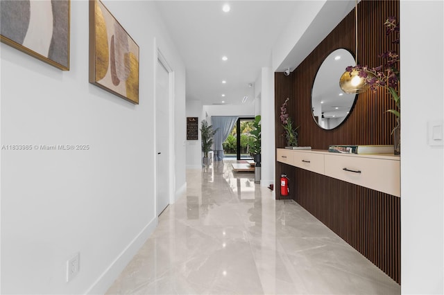 436 NE 10th Ave, Fort Lauderdale, FL 33301 - corridor featuring light marble finish floors and recessed lighting