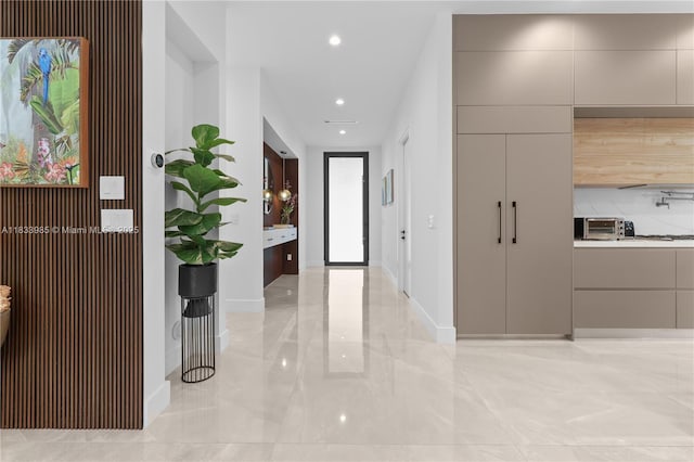 436 NE 10th Ave, Fort Lauderdale, FL 33301 - corridor with recessed lighting and light marble finish floors