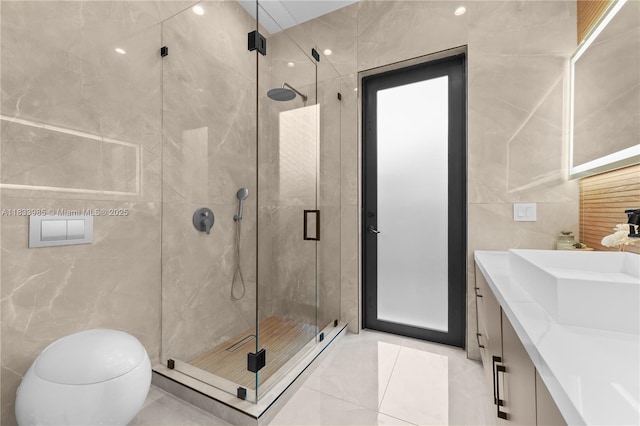 436 NE 10th Ave, Fort Lauderdale, FL 33301 - full bath featuring tile walls, vanity, a shower stall, and tile patterned floors