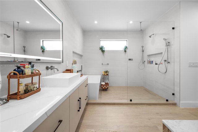 436 NE 10th Ave, Fort Lauderdale, FL 33301 - full bath with a tile shower, a freestanding tub, vanity, and recessed lighting