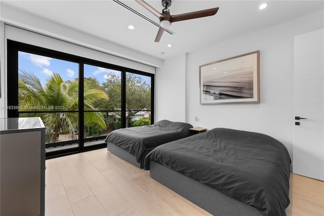 436 NE 10th Ave, Fort Lauderdale, FL 33301 - bedroom with recessed lighting, light wood-style flooring, ceiling fan, and access to outside